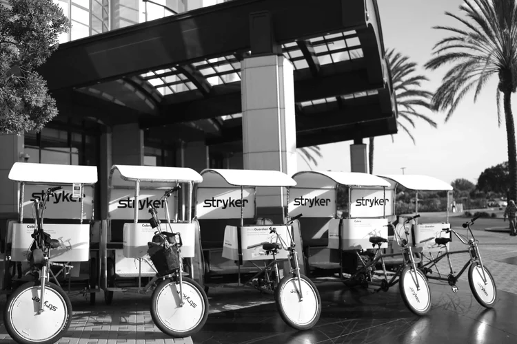 Row of branded VIP pedicabs